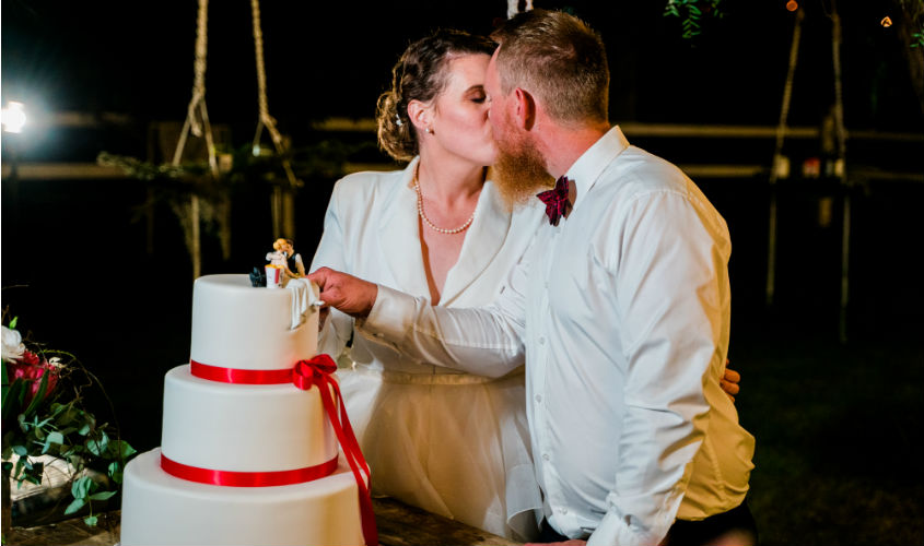 KFC Weddings Kate and Harrison Cann cutting wedding cake 2