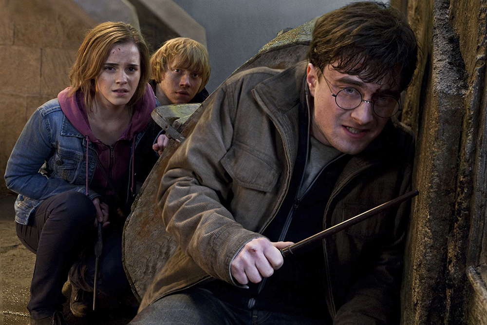 FILE-   In this file film publicity image released by Warner Bros. Pictures, from left, Emma Watson, Rupert Grint and Daniel Radcliffe are shown in a scene from 
