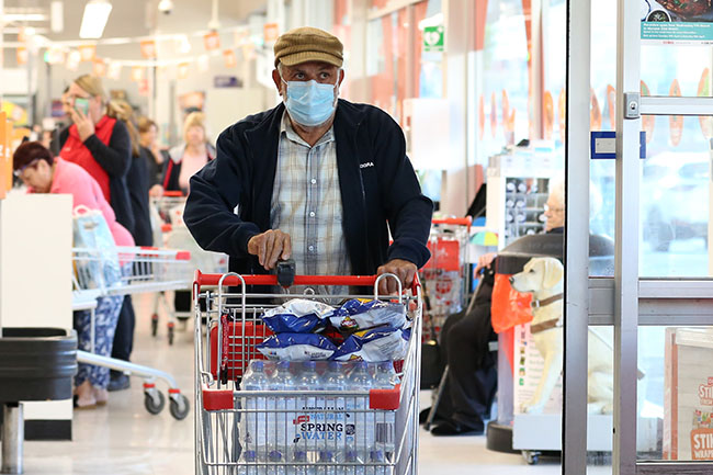 Shoppers are seen at Coles in Earlwood, in Sydney, Wednesday, March 18, 2020. Coles will on Wednesday hold its first 