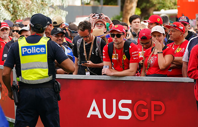 Spectators queue at the gate to gain entry ahead of the Formula 1 Australian Grand Prix 2020 at the the Albert Park Circuit in Melbourne, Friday, March 13, 2020. (AAP Image/Scott Barbour) NO ARCHIVING, EDITORIAL USE ONLY