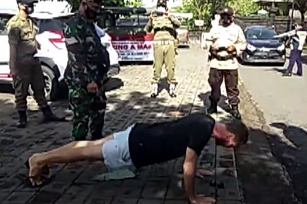 foreigners forced to do pushups in bali