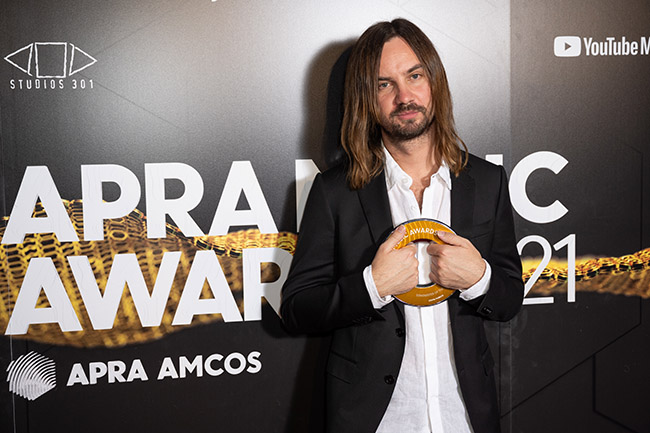 Kevin Parker of Tame Impala holding his award for ‘Songwriter of the Year’ at The APRA Music Awards, in Sydney, Wednesday, April 28, 2021. (AAP Image/James Gourley) NO ARCHIVING