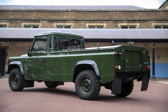 The Jaguar Land Rover that will be used to transport the coffin of the Duke of Edinburgh at his funeral on Saturday, is pictured at Windsor Castle, in Berkshire, England, Wednesday, April 14, 2021. The modified Land Rover Defender TD5 130 chassis cab vehicle was made at Land Rover's factory in Solihull in 2003 and Philip oversaw the modifications throughout the intervening years, requesting a repaint in military green and designing the open top rear and special 