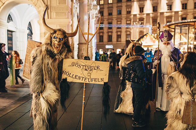 Graz, Austria - December 2017: Krampus masked People in Graz at a Krampus Festival parade for advent before Christmas