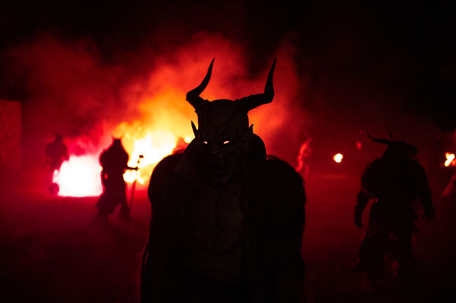 Silhouette of a krampus mask