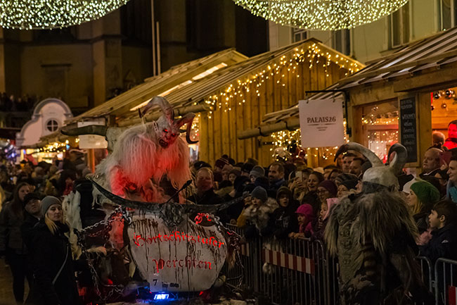 Villach, Austria - November 29, 2019: A Krampus, a horned, anthropomorphic pre-christian traditional figure in the Alpine Region, at the yearly Perchtenlauf in Villach.