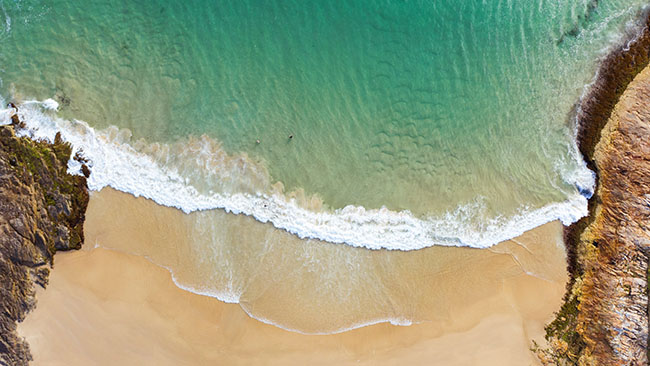 Scenic aerial views overlooking Horseshoe Bay Beach, South West Rocks.