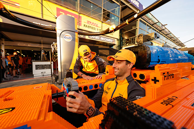 Daniel Ricciardo, McLaren, and Lando Norris, McLaren, with a lego F1 car